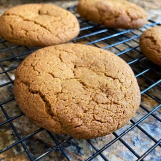 A soft molasses ginger cookie with a dusting of cinnamon and sugar, perfect for holiday baking.